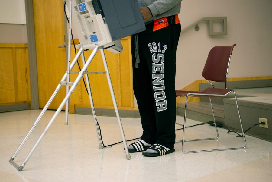 A voter casts his ballot at the Carbondale Civic Center on Election Day, Nov. 3, 2020, in Carbondale, Ill. 
