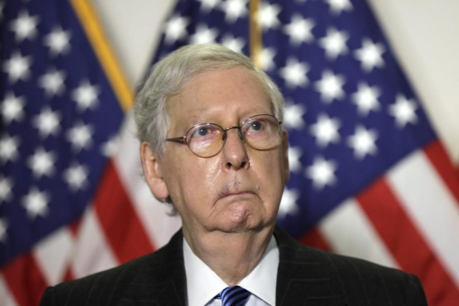 U.S. Senate Majority Leader Mitch McConnell (C) talks to the media after the Republican policy luncheon on Capitol Hill in Washington on October 20, 2020.