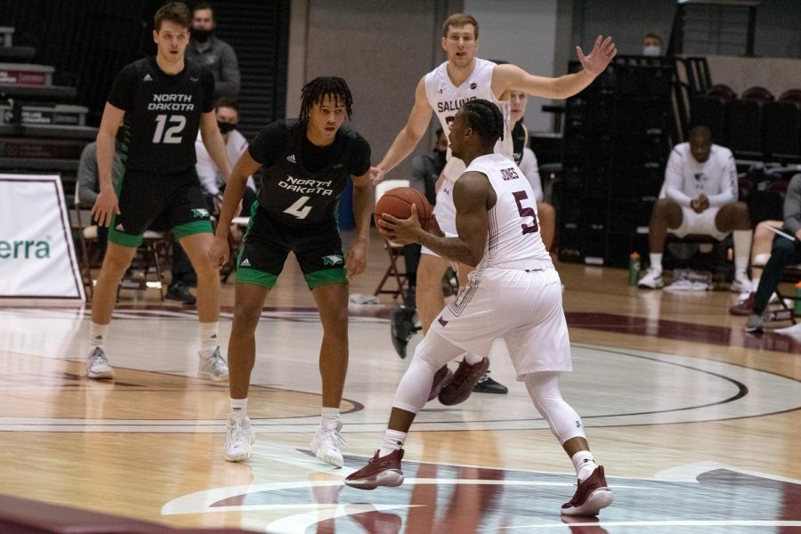 Lance Jones prepares to pass the ball during the SIU vs. North Dakota game Friday, Dec. 18, 2020, at the SIU Bantera Center in Carbondale Ill. SIU won with a final score of 62 to 50.