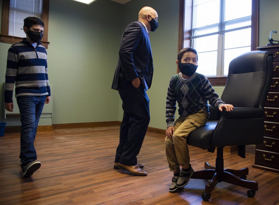Newly sworn in States Attorney Joe Cervantez, center, inspects his new office with his sons Canon, 10, and Cason, 7, at the Jackson County Courthouse in Murphysboro, Ill. Dec. 1, 2020.