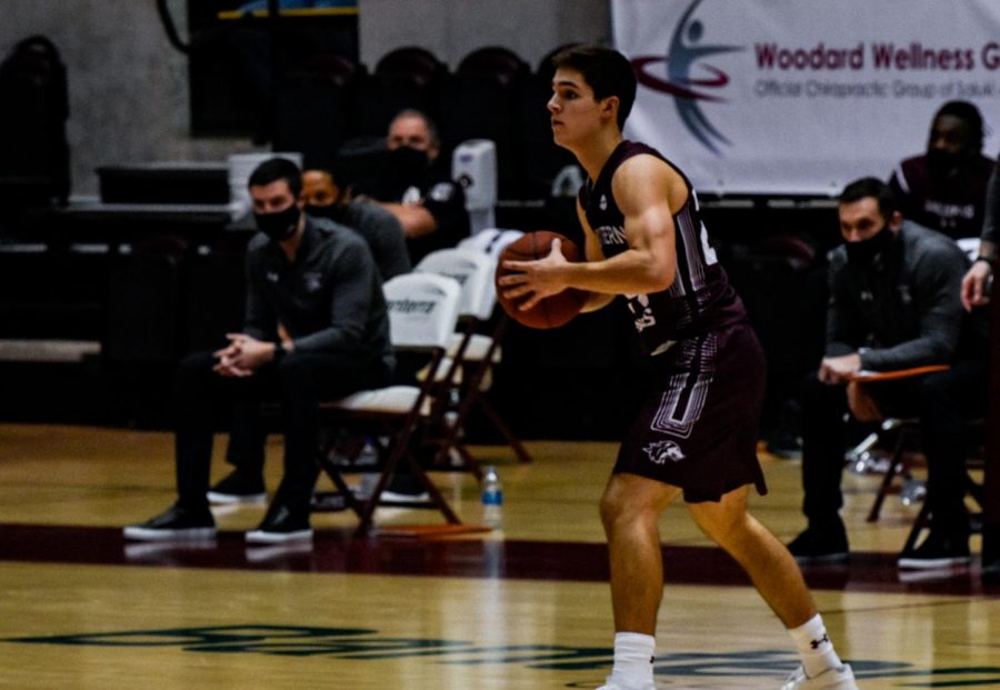 Trent+Brown+%2824%29+tries+to+defend+the+ball+against+the+Evansville+Purple+Aces+Friday%2C+Dec+28+2020%2C+at+the+SIU+Bantera+Center+in+Carbondale+IL.