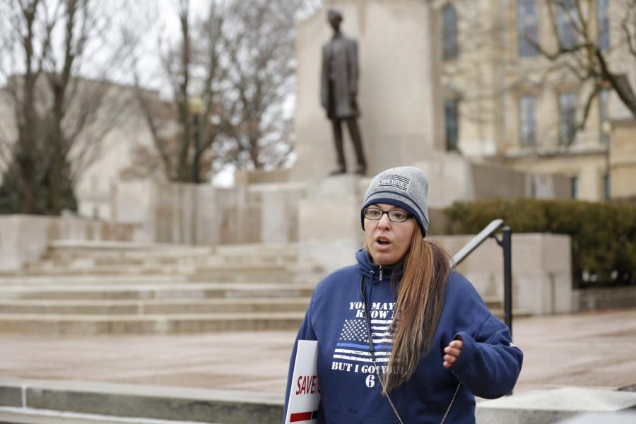 Ashley Ramos, a member of the nonprofit organization Back the Blue, which supports members of law enforcement and first responders, stands outside of the Illinois State Capitol building, protesting the recently signed police reform bill, Springfield, IL, Saturday, January 16, 2021.