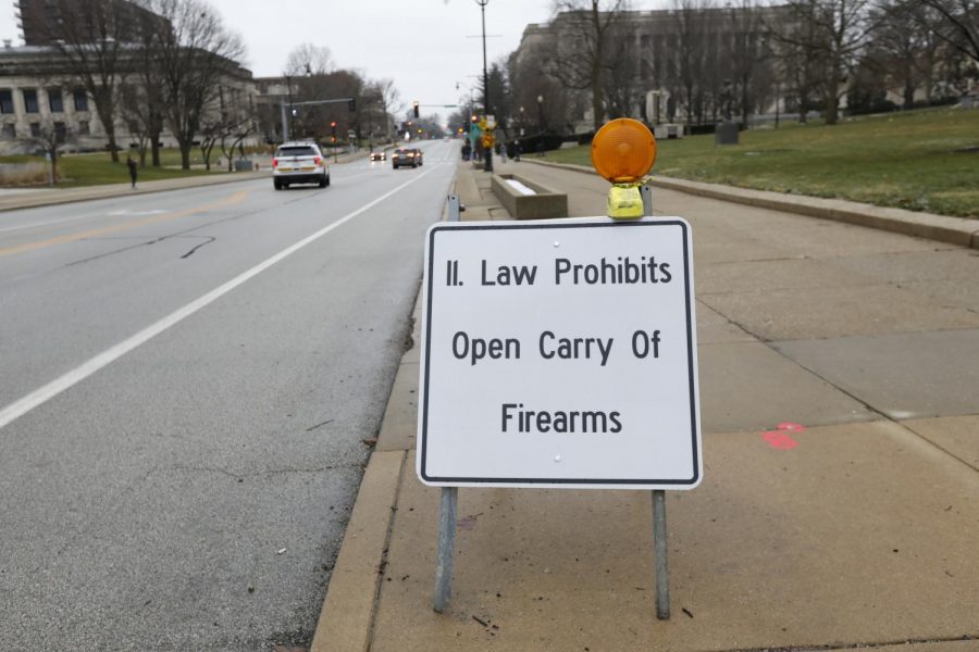 A sign outside fo the Illinois State Capitol building reminding citizens that “Illinois Law Prohibits Open Carry of Firearms,” Springfield, IL, Saturday, January 16, 2021.