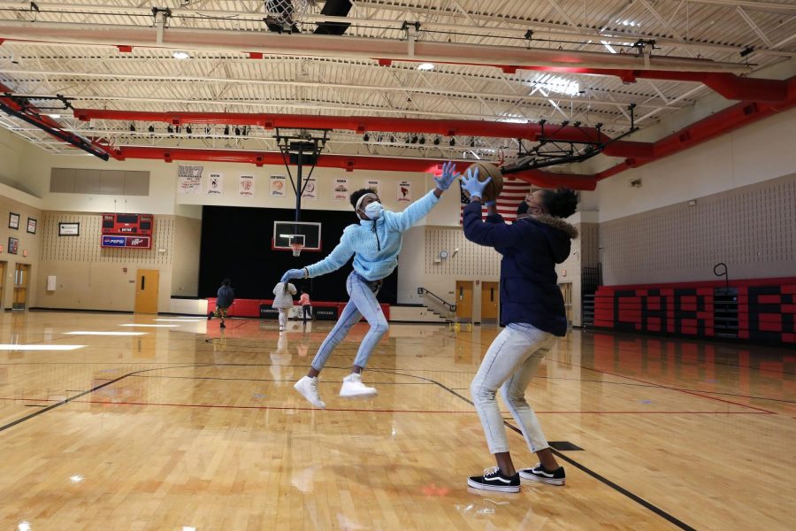 Carbondale Middle School students, Alliyah T., left, and Neviah L., play basketball during a physical education class on the last day of in-person learning, Carbondale, IL, Friday, November 13, 2020.
