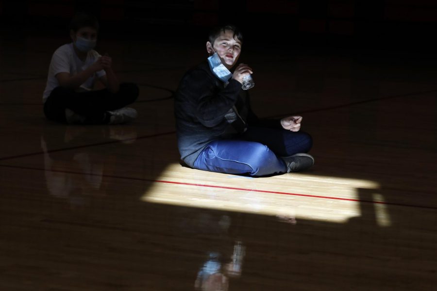 Carbondale Middle School student Hayden M. drinks from a plastic water bottle after gym class on the last day of in-person learning at the school, Friday, November 13, 2020.
