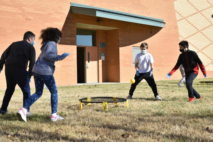 A group of students play a game of spike ball during P.E. at Carbondale Middle School Nov. 13, 2020.