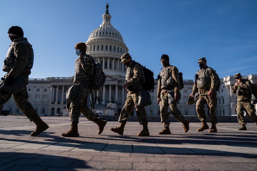 Members of the National Guard, outside the U.S. Capitol Building, a day after the House of Representatives impeached President Donald Trump, and over a week after a pro-Trump insurrectionist mob breached the security of the nations capitol, on Thursday, Jan. 14, 2021, in Washington, D.C.