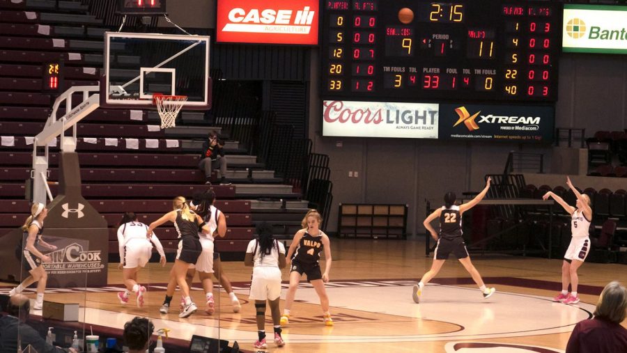 SIU guard, Caitlin Link (5), shoots the ball from a distance attempting to catch the team’s score back up to the Valparaiso Crusaders Saturday, February 27, 2021, in Carbondale, Ill.