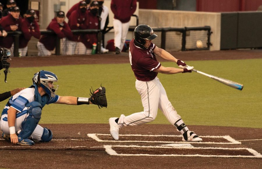 Vinni Massaglia (10) scored a run against Eastern Illinois on Tuesday, Feb. 23, 2021 at Itchy Jones Stadium in Carbondale, Ill. SIU went on to win 10-8.
