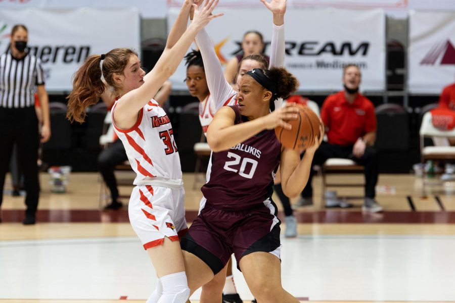 Gabby Walker (20) tries to avoid a turnover during the game against Illinois State on Saturday, Feb.6, 2021, in the Banterra Center at SIU. Salukis went on to win 43-41 to the Redbirds.