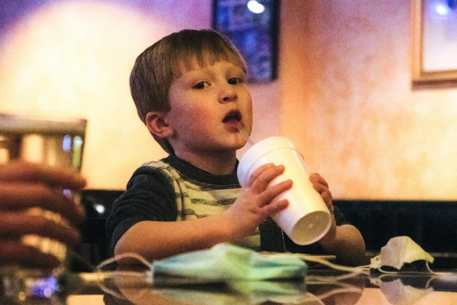 Tripp Zollner enjoys his drink after school on Friday, Feb. 25, 2021 at Pagliais Pizza in Carbondale, Ill. “I love doing adventurous things. We went hiking last weekend and I love food,“ Zollner said.