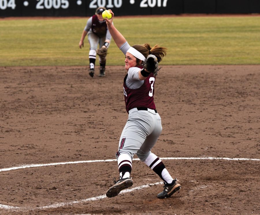 Madi Eberle (3) pitches in the game against Ball State University on Saturday, Feb. 27, 2021 at Charlotte Softball Stadium in Carbondale, Ill. Eberle later scored the run of the season against Ball state University. SIU went on to win against Ball State with the score of 6-1.