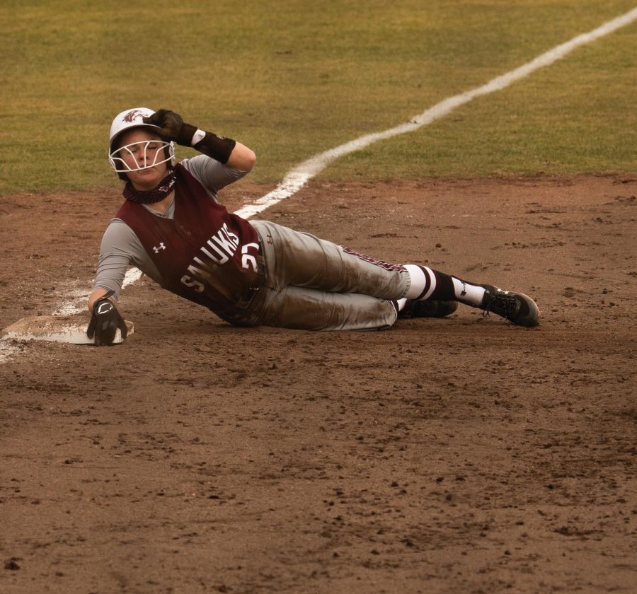 Tori Schullian (25) steals a base against Ball State University during the third inning of the game on Saturday, Feb. 27, 2021 at Charlotte Softball Stadium in Carbondale, Ill.