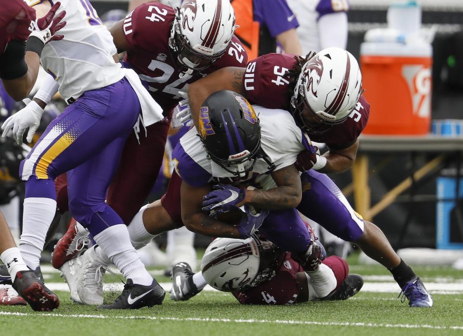 Saluki defenders Qua Brown, #24, and Bryce Notree, #54, help stop the Panthers’ running game during SIU’s 17-16 win over Northern Iowa University at Saluki stadium on Saturday, March 13, 2021.