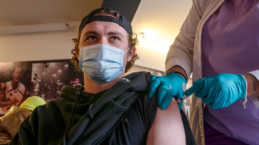 Andrew Robinson, 24, receives his COVID-19 vaccination Wednesday, March 18, 2021, in Carbondale, Ill. “It didn’t even feel like I got stuck,” Robinson said. 