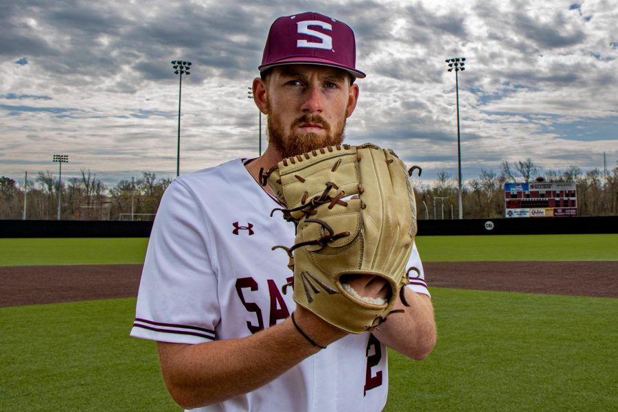 SIU pitcher, Brad Harrison, poses for a portrait in the bleachers at Itchy Jones Stadium on Wednesday, March 31, 2021 at SIU. Coming back after injuring his arm, the left-handed pitcher has been a steady arm in the Salukis' rotation. This season, Harrison threw seven innings where he struck out nine batters and two hits during a game against Marshall.    