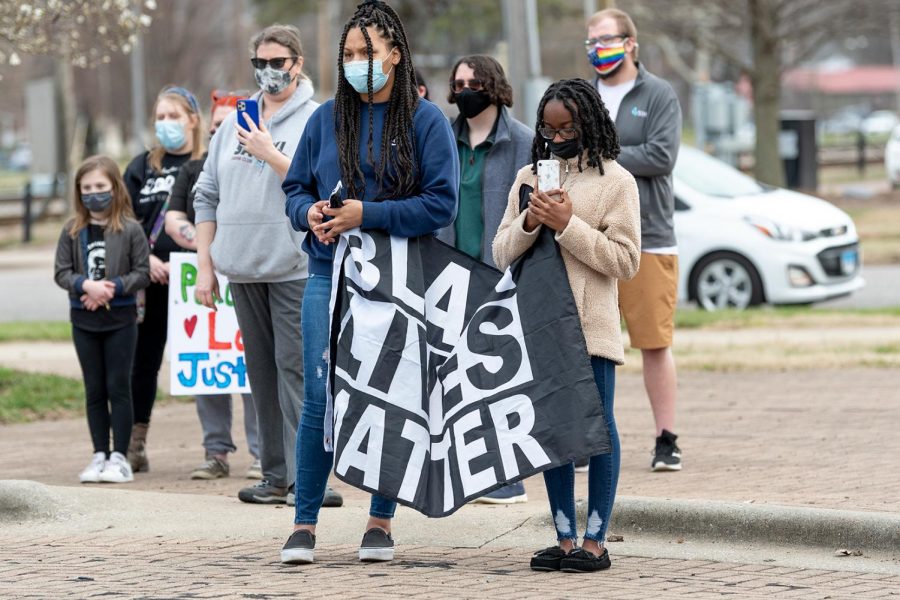 Protestors hold up a Black Lives Matter sign during the protest on the one-year anniversary of Breonna Taylor’s death on Saturday, Mar. 13, 2021 at the Carbondale Pavilion in Carbondale, Ill. 