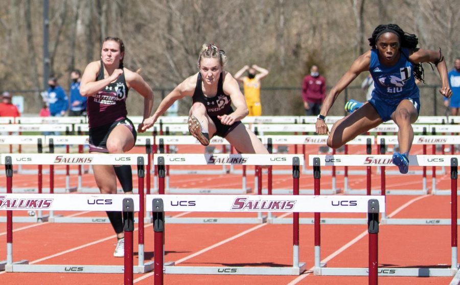 Savannah Long takes a jump in the 100-meter hurdles race on Saturday, March 20, 2021, at the SIU Lew Hartzog Track and Field Complex in Carbondale, Ill.