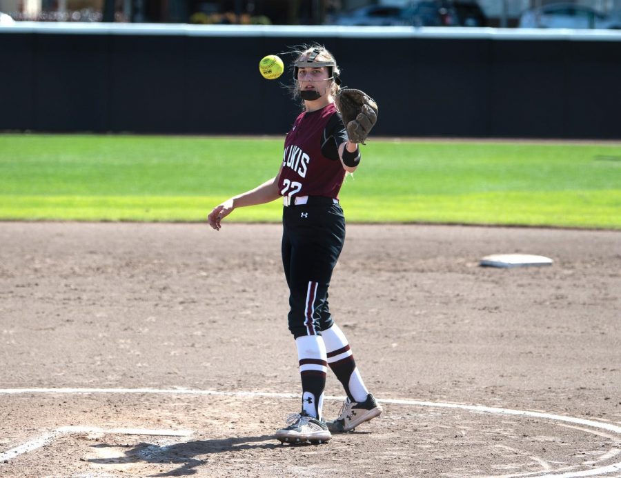 Sarah Harness (22), pitcher, receives the ball back from the catcher during the game against Drake University on Sunday, March 21, 2021 at SIU.