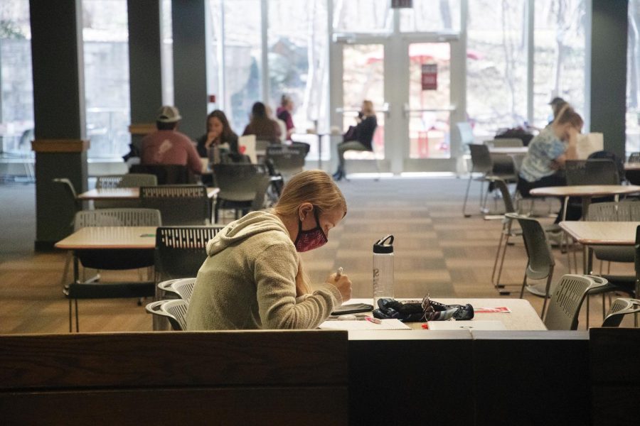 Madison Fleege, an undergraduate student from Radiation Therapy department, works on her assignments on Thursday March. 4, 2021 at the Student Center in Carbondale, Ill. There has been a rapid increase in the number of students at the food court with the decline in COVID-19 cases and the readily available COVID-19 vaccines.