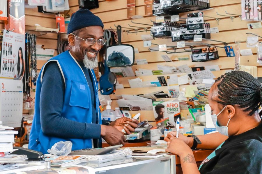 Abdul Rahim Khalil assists a customer Mar. 1, 2021, at Rahim’s Beauty Supply in Carbondale, Ill. Khalil said he noticed there were not many Afican-American owned businesses, especially beauty stores, in the southern Illinois area, so he decided to create one himself. 