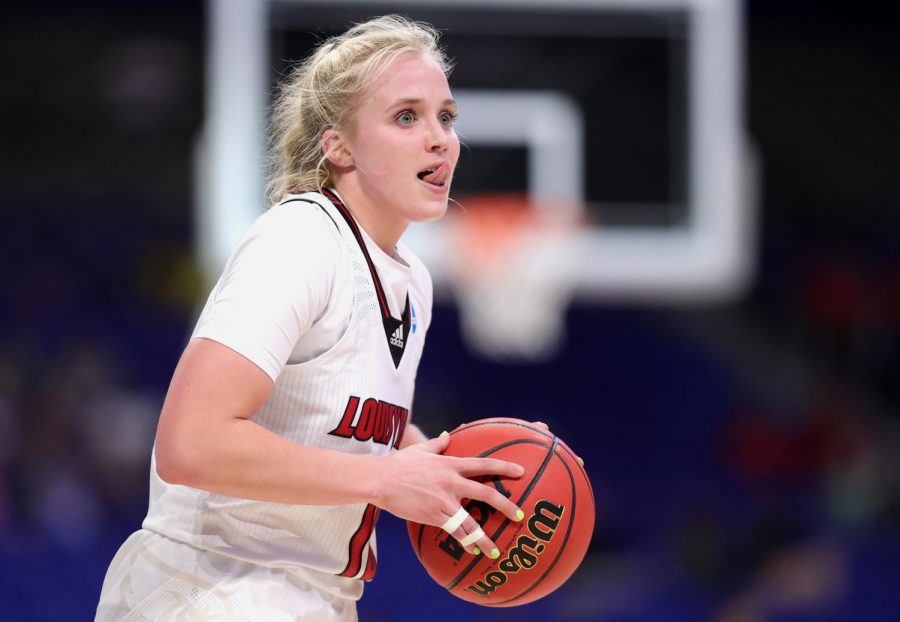 Hailey Van Lith #10 of the Louisville Cardinals looks to pass during the second half against the Oregon Ducks in the Sweet Sixteen round of the NCAA Womens Basketball Tournament at the Alamodome on March 28, 2021, in San Antonio, Texas. 