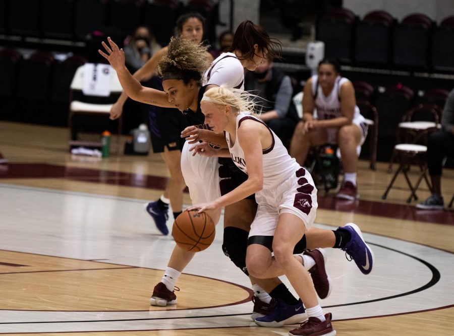 Caitlin Link (5) dribbles the ball against the Northern Iowa Panthers on Friday, Mar. 5, 2021 at the SIU Banterra Center in Carbondale Ill. Monica Sharma | @mscli_cks 