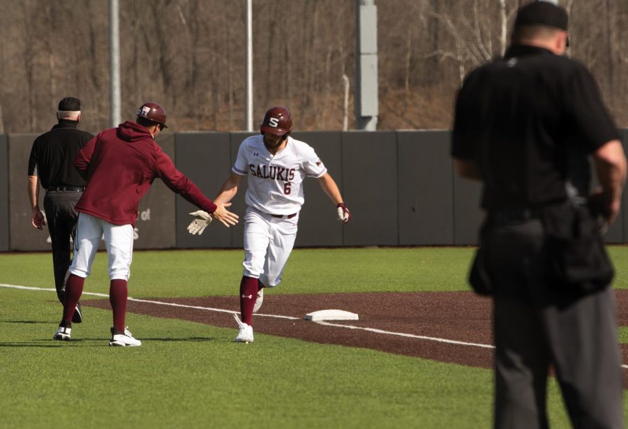 Tristen Peters (6) celebrates with a teammate after a home game against University of Tennessee at Martin on Sunday, Mar. 7, 2021 at Itchy Jones Stadium in Carbondale Ill.