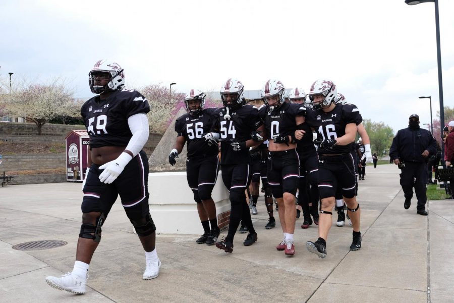 The SIU Salukis walk to the stadium on Saturday, April, 17, 2021 for the game against Southeastern Louisiana University in Carbondale, Ill.