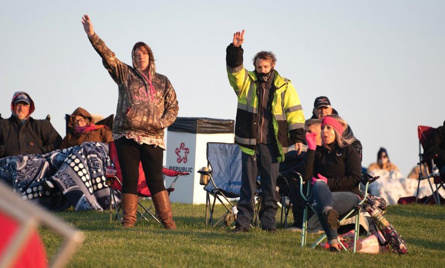 People raise their hands during Easter Sunrise Service at Bald Knob Cross on Sunday, April 4, 2021 in Alto Pass, Ill.