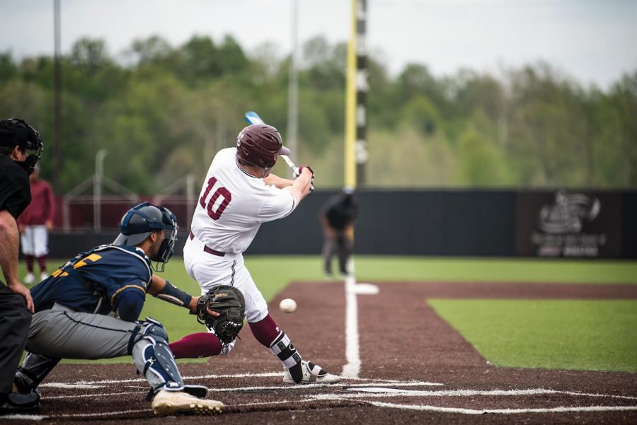 Vinni Massaglia (10) makes a hit over Murray State on Tuesday, April 27, 2021 at Itchy Zones Stadium in Carbondale, Ill.