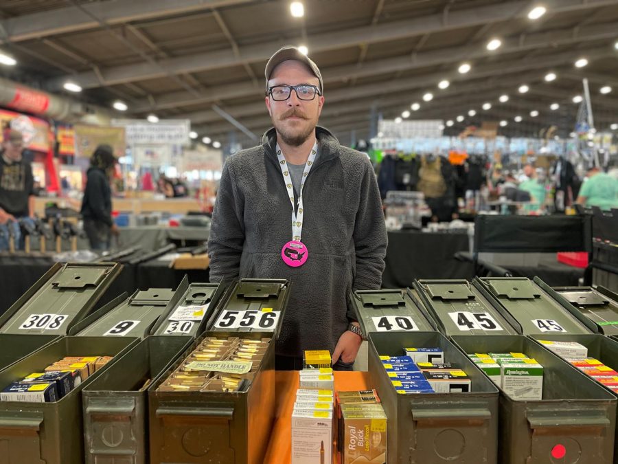 Scott Chelle, an ammo collector, stands behind his booth at the Wanenmacher’s Tulsa Arms Show. The  show was a two day event that  took place on April 10 and 11 at Expo Square in Tulsa, Okla. “We have been holding ammo for a long time in the stores and now we got a chance to sell it in our booth today. We are very excited and getting good responses from the customers,” Chelle said. 