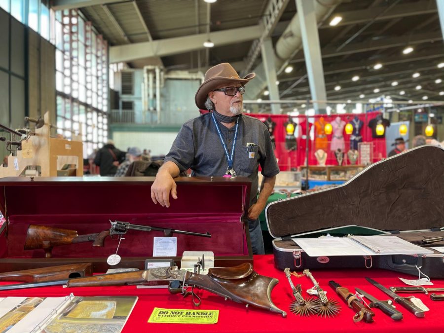 A seller talks about his old vintage guns at the Wanenmacher’s Tulsa Arms Show on April 10 and 11, 2021, at Expo Square in Tulsa, Okla.