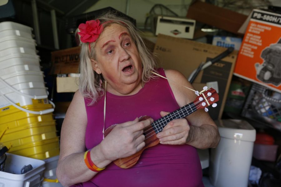 Susan Stone, also known as the ‘Dance of Life Dancer, poses with her ukulele outside of her trailer in Lenzburg, IL.  Stone has been dancing in local parks, concerts and festivals for 21 years and credits her ‘Dance of Life’ passion for giving her hope, “It refreshes me with energy, refreshes me with life and hope!” Susan said.
