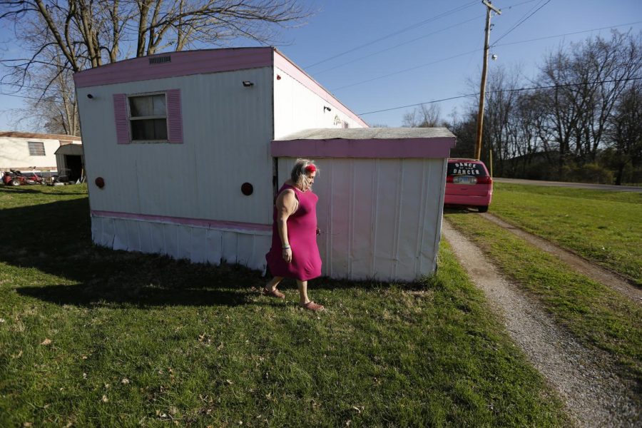Susan Stone walks outside of her trailer in Lenzburg, Ill., Sunday, March 28, 2021.