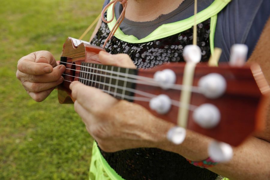 Susan Stone, also known as the Dance of Life Dancer, plays her ukulele.