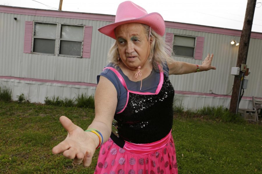 Susan Stone, also known as the Dance of Life Dancer, illustrates a few of her signature dance moves outside of her trailer home in Lenzburg, IL.