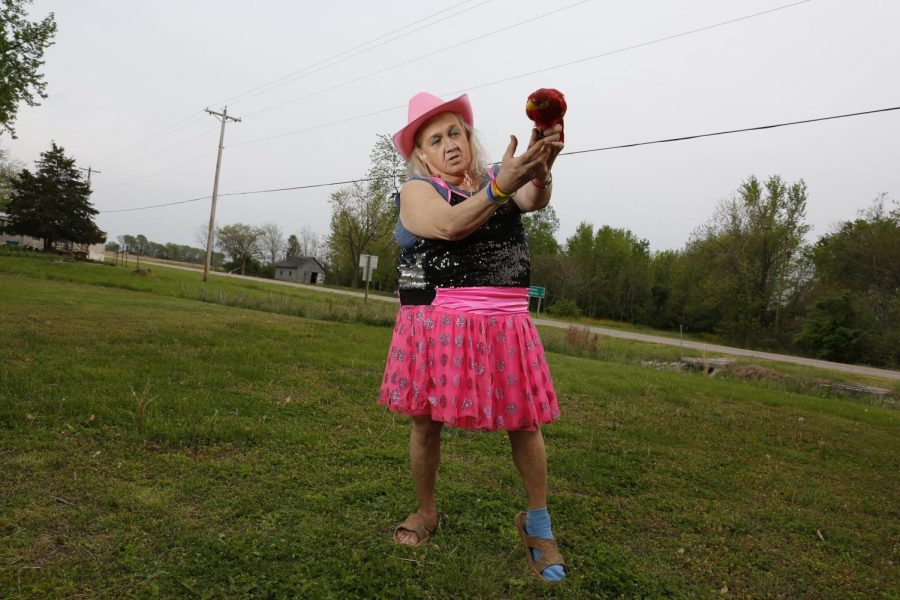 Susan Stone, also known as the Dance of Life Dancer, demonstrates a few of her signature dance moves outside of her trailer in Lenzburg, Ill.