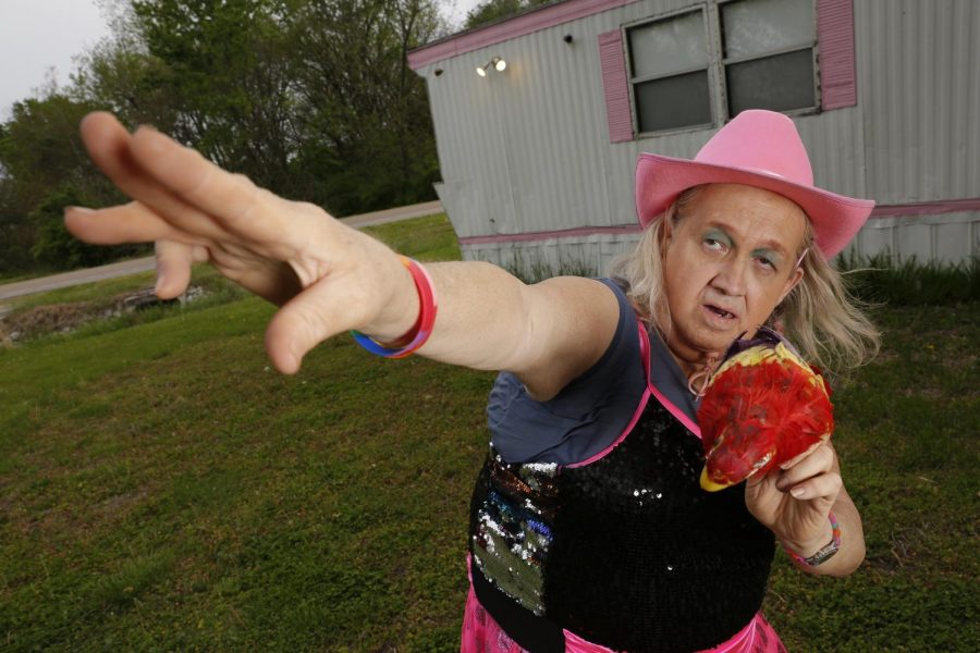 Susan Stone, also known as the Dance of Life Dancer, demonstrates a few of her signature dance moves outside of her trailer in Lenzburg, Ill. Stone has been dancing in local parks, concerts and festivals for 21 years and credits her “Dance of Life” passion for giving her hope, “It refreshes me with energy, refreshes me with life and hope!” Stone said.