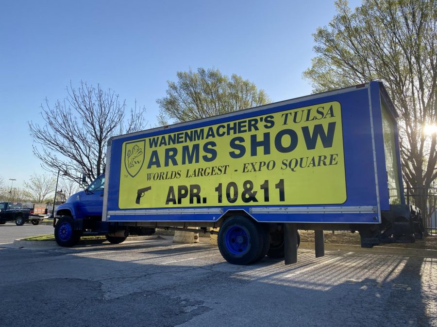 A truck advertises the worlds largest gun show at the entrance of the Tulsa fairgrounds at the Wanenmacher’s Tulsa Arms Show on April 10 and 11, 2021, in Tulsa, Okla.