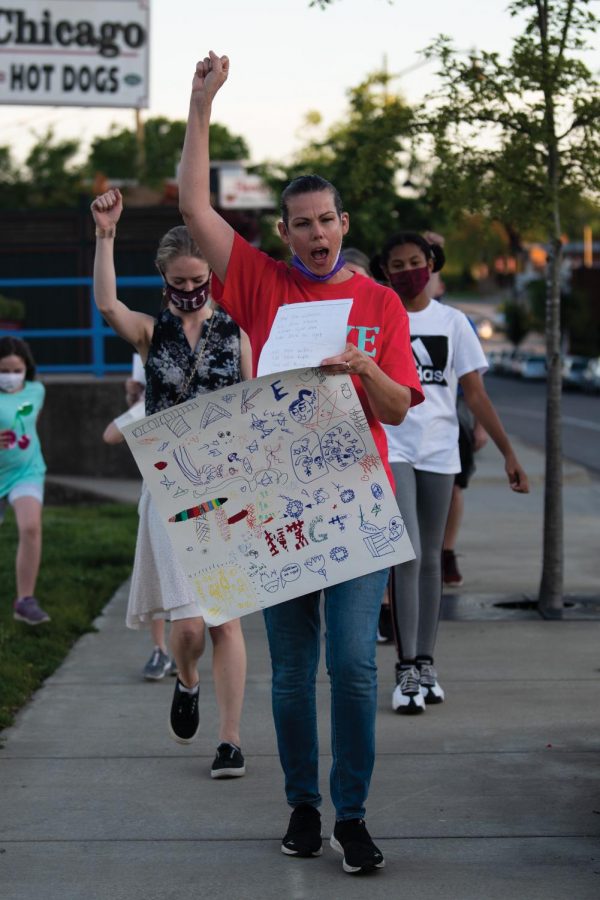 Sarah Settles leads the march with slogans during the event of the stand with survivors of sexual violence on Friday, April 30, 2021 in Carbondale, Ill. ”Take back the night is organized to bring awareness among people about the violence,” Settles said.