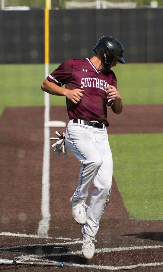 Trisan Peters (6) attempts a home run in a home game against Missouri State University on Saturday, May 1, 2021, at Itchy Jones Stadium in Carbondale Ill.