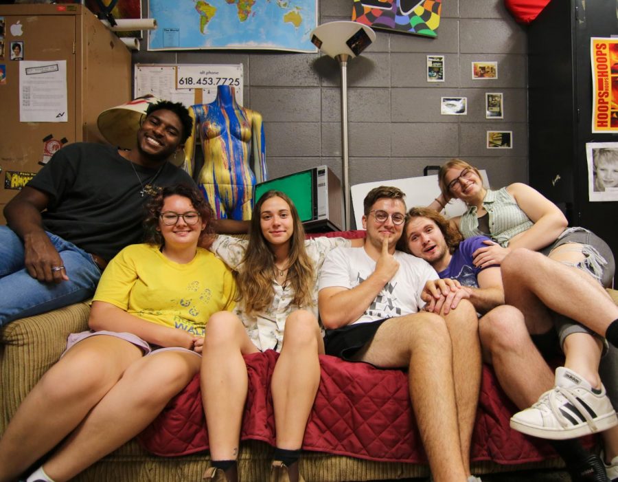 (Pictured from Left to Right) Kylen Lunn, Sara Davis, Hannah Friedman, Ara J. Rice, Brock Mills, and Devin Welchman; the six staff members of Alt News 26:46 sitting in the Alt News editing space called The Loft located in the Communications building at Southern Illinois University of Carbondale.