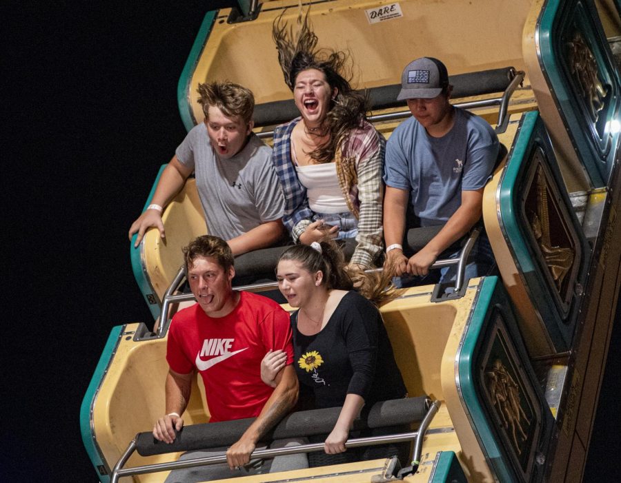 A group of fairgoers react during a ride at the State Fair on Friday, Aug. 27, 2021 in DuQuoin, Illinois. 