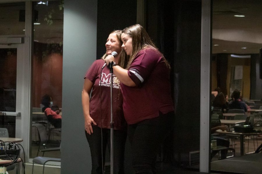Saluki mom Amanda Jackson (left) and SIU student Ashley Jackson (right) sing “Fancy” by Reba Sept. 24, 2021 during the Family Weekend karaoke event at the SIU student center in Carbondale, Ill. “I just wanted to make some memories for family weekend.” Ashely Jackson said. 