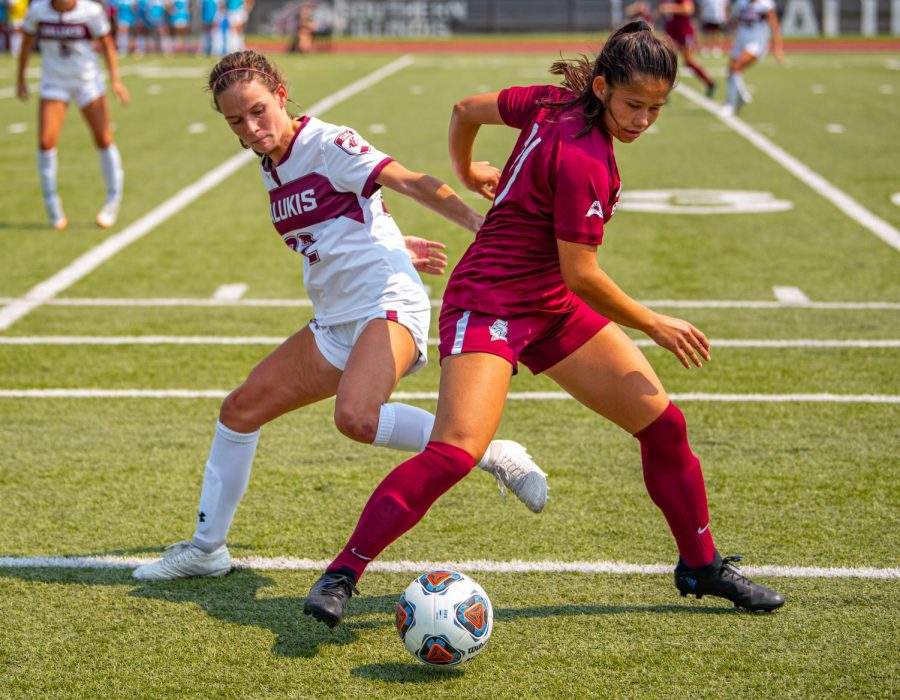 SIU freshman defender, Kylie McDermott, goes head to head with a Knight player during the Salukis game against Bellarmine University, where the Knights won 2-0 against the Salukis on Sunday, Sept. 12, 2021 at Lew Hartzog Track and Field Complex at SIU. 