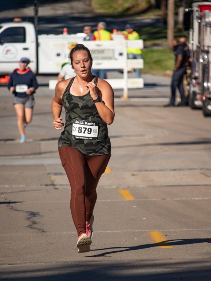 Jessica Anderson, age 35, of team Red, White and Blue runs toward the finish line at the Superhero 5K Sept. 25, 2021 in Carbondale, Ill. 