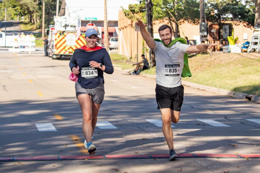 Sarah Gray, age 31, and William Gray, age 35, cross the finish line in 27th and 28th place Sept. 25, 2021 in Carbondale, Ill. 