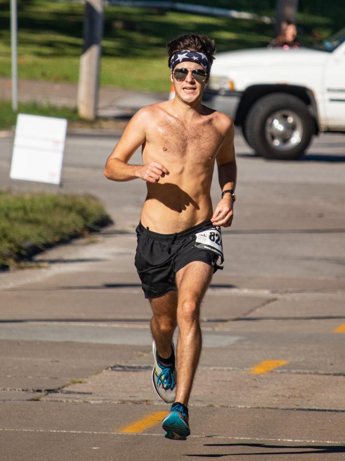 Matthew Kovich, age 20, sprints toward the finish line at the For Kids Sake Superhero 5K Sept. 25, 2021 in Carbondale, Ill. 