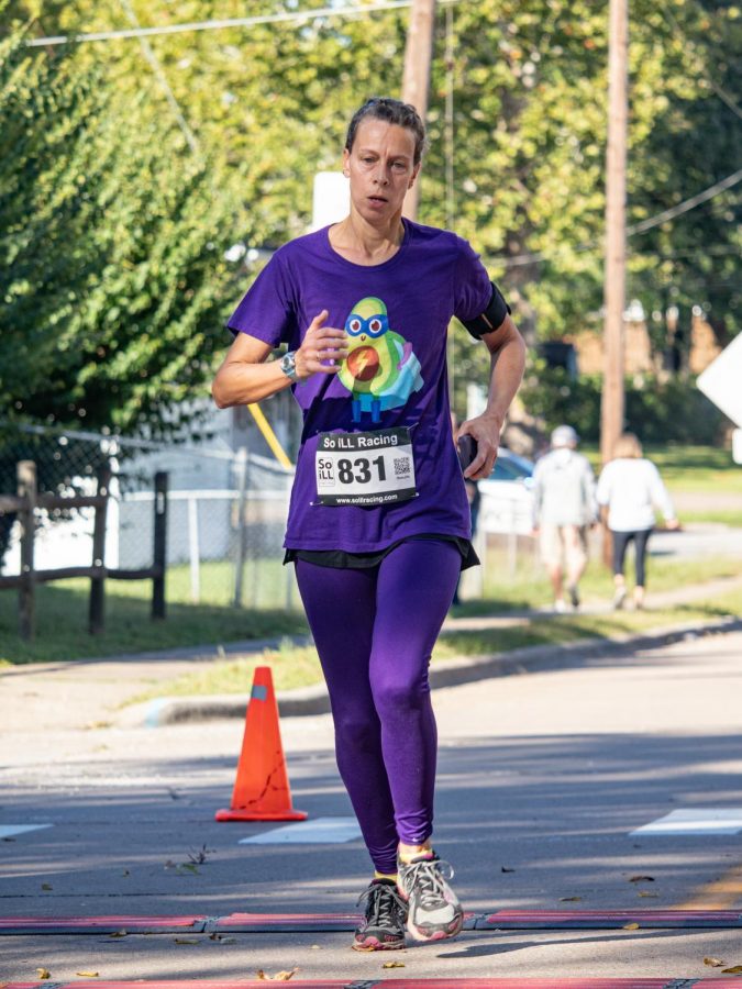 Amy Holster, age 48, participates in the For Kids Sake Superhero 5K Sept. 25, 2021 in Carbondale, Ill. 
